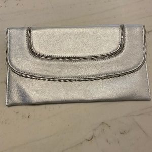 Zipper accent silver clutch